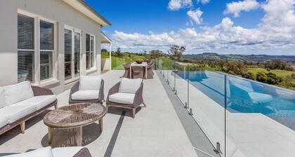 Expansive Hamptons home on acreage, with pool, spa, gym, tennis court & views.