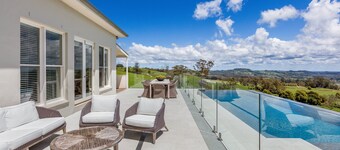 Expansive Hamptons home on acreage, with pool, spa, gym, tennis court & views.