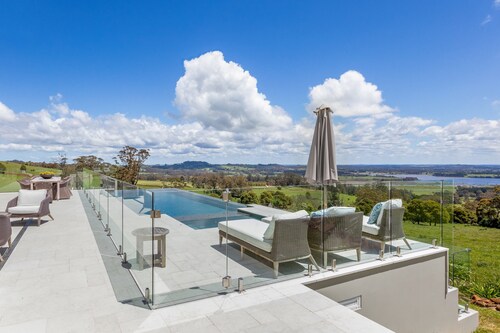 Expansive Hamptons home on acreage, with pool, spa, gym, tennis court & views.