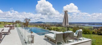 Expansive Hamptons home on acreage, with pool, spa, gym, tennis court & views.