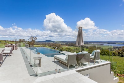 Expansive Hamptons home on acreage, with pool, spa, gym, tennis court & views.