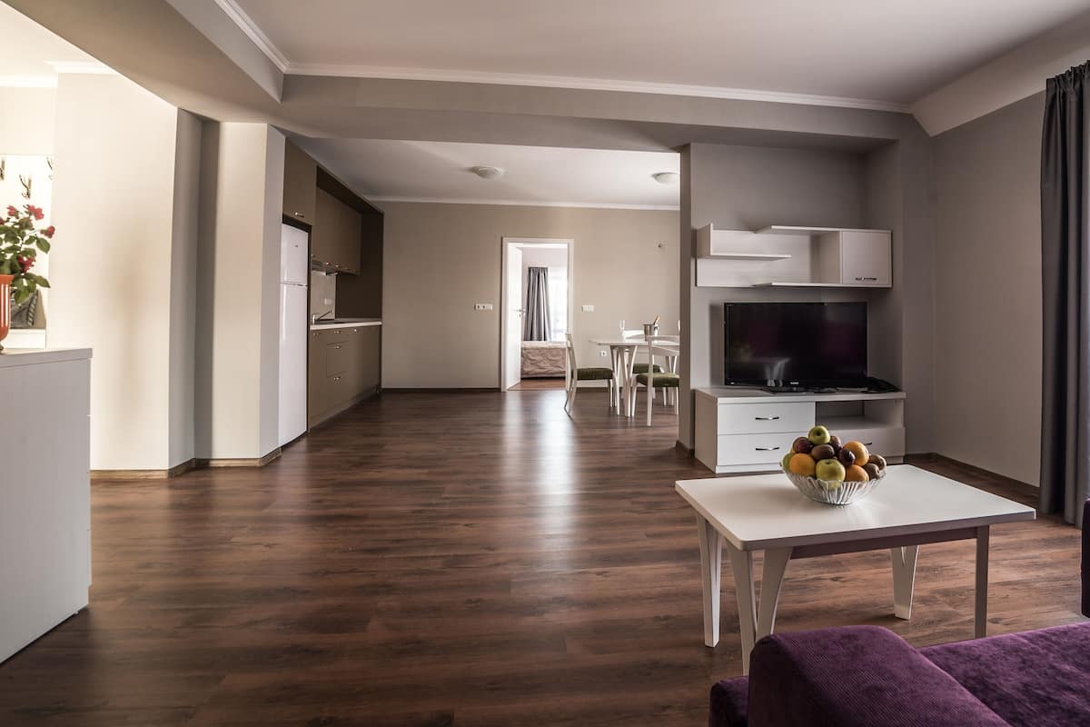 Luxury Apartment, Partial Sea View | Living area | Flat-screen TV