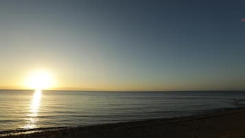 Private beach nearby, black sand