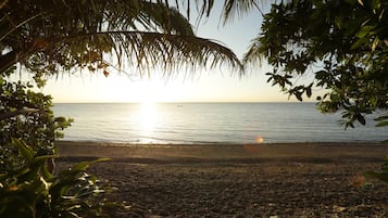 Private beach nearby, black sand