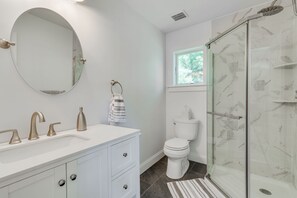 Bathtub, hair dryer, towels, soap