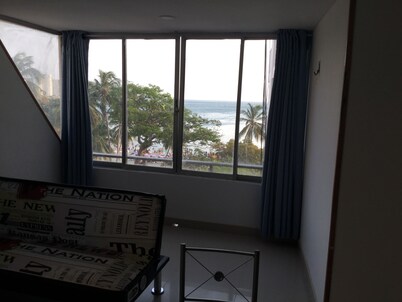 Apartment in beachfront. Views of the sea, mountains and city.