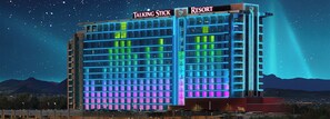 A multi-story hotel with illuminated signage reading "Talking Stick" and "Resort". - Staybridge Suites Scottsdale - Talking Stick by IHG (Scottsdale)