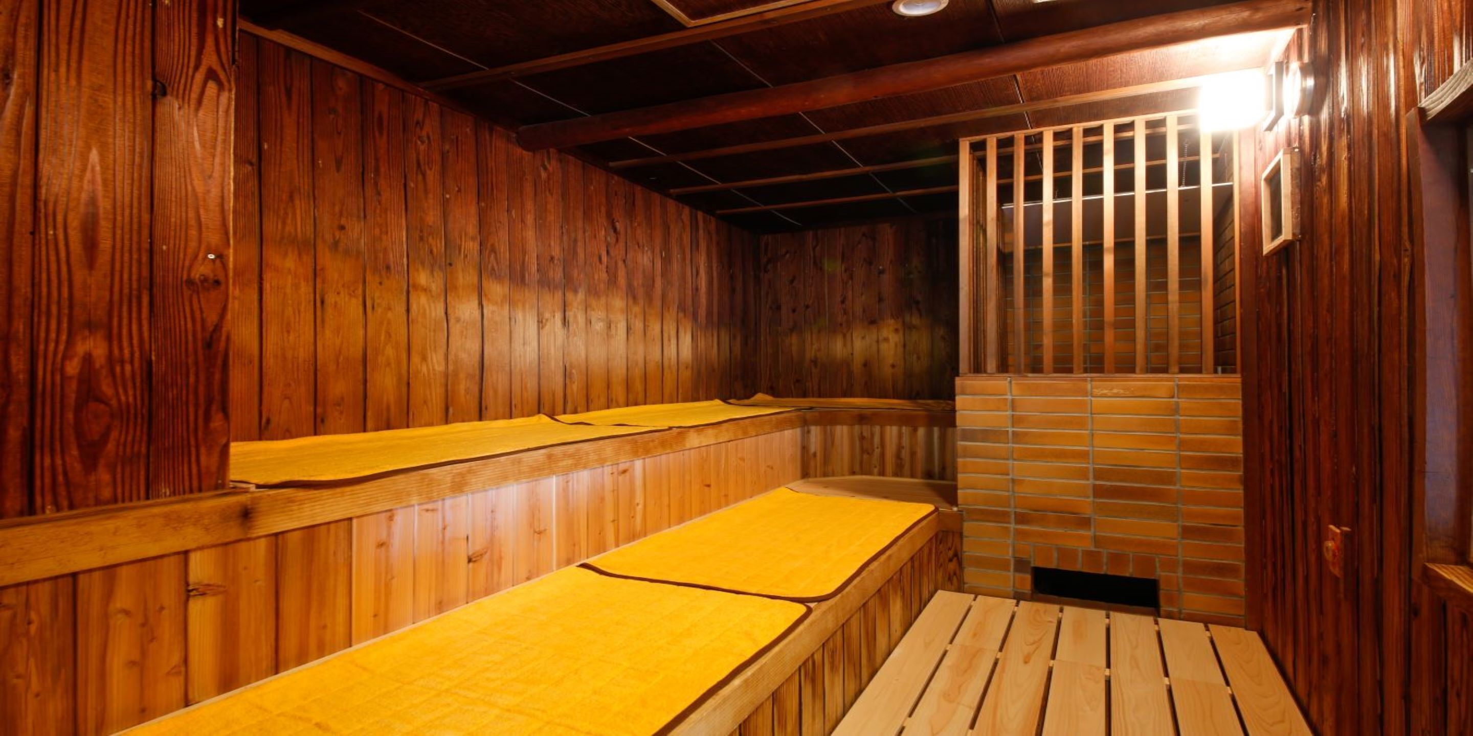 A sauna with wooden walls and benches.