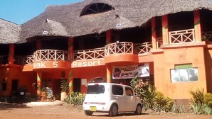 A building with a thatched roof and a sign reading "Mak 5 Resort". - Mark5 Resort (Njumbi)