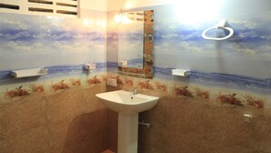 A bathroom with a sink, mirror, and towel rack.