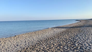 On the beach, sun-loungers, beach towels