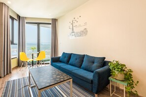 Apartment, 3 Bedrooms | Living room | Flat-screen TV