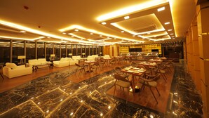 A spacious hotel lobby with marble flooring, multiple seating areas, and a well-lit ceiling. - Royal Swiss Lahore (Lahore)