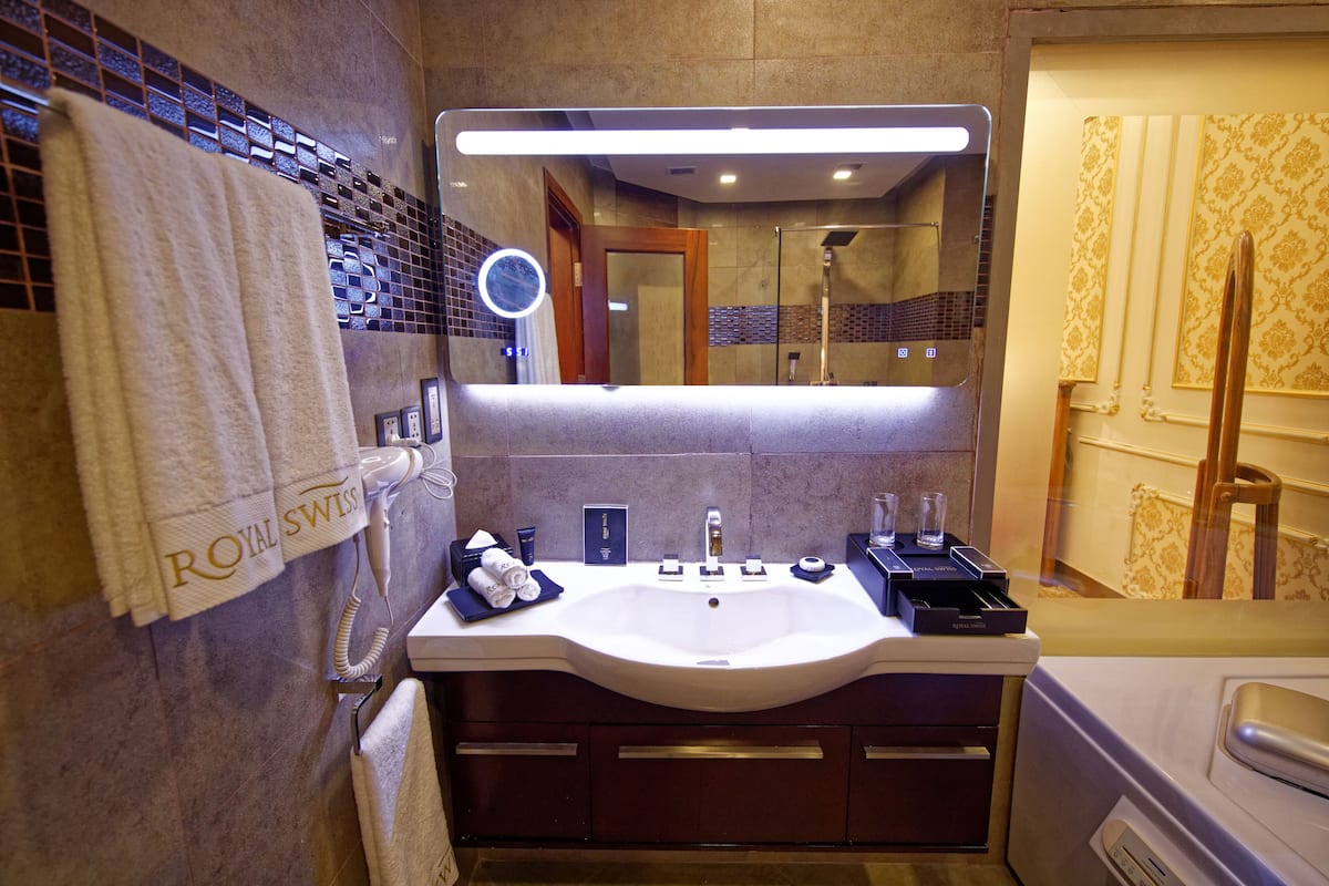 separate bathtub and shower, free toiletries, hair dryer, slippers