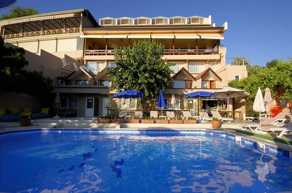 Seasonal outdoor pool, open 9:00 AM to 7:00 PM, pool umbrellas