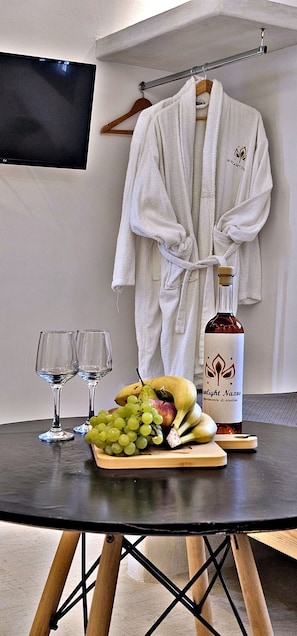 Superior Suite | Living area | 28-inch flat-screen TV with cable channels, TV