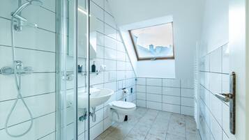 Shower, rainfall showerhead, hair dryer, towels