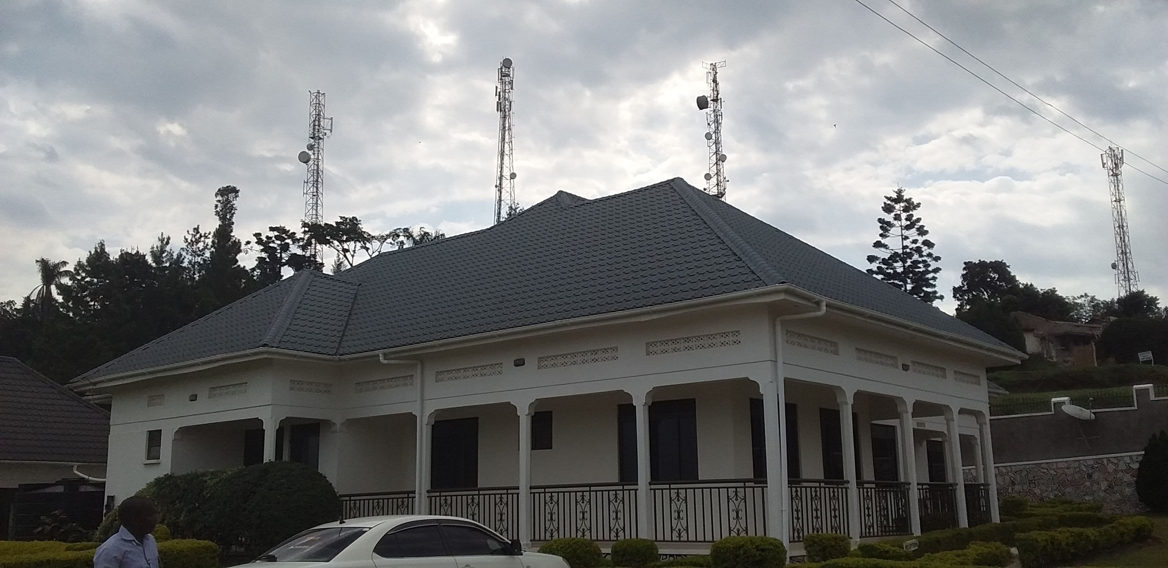 A two-story house with a gabled roof and a covered porch.