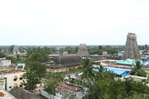 A temple complex with multiple towers and surrounding buildings.