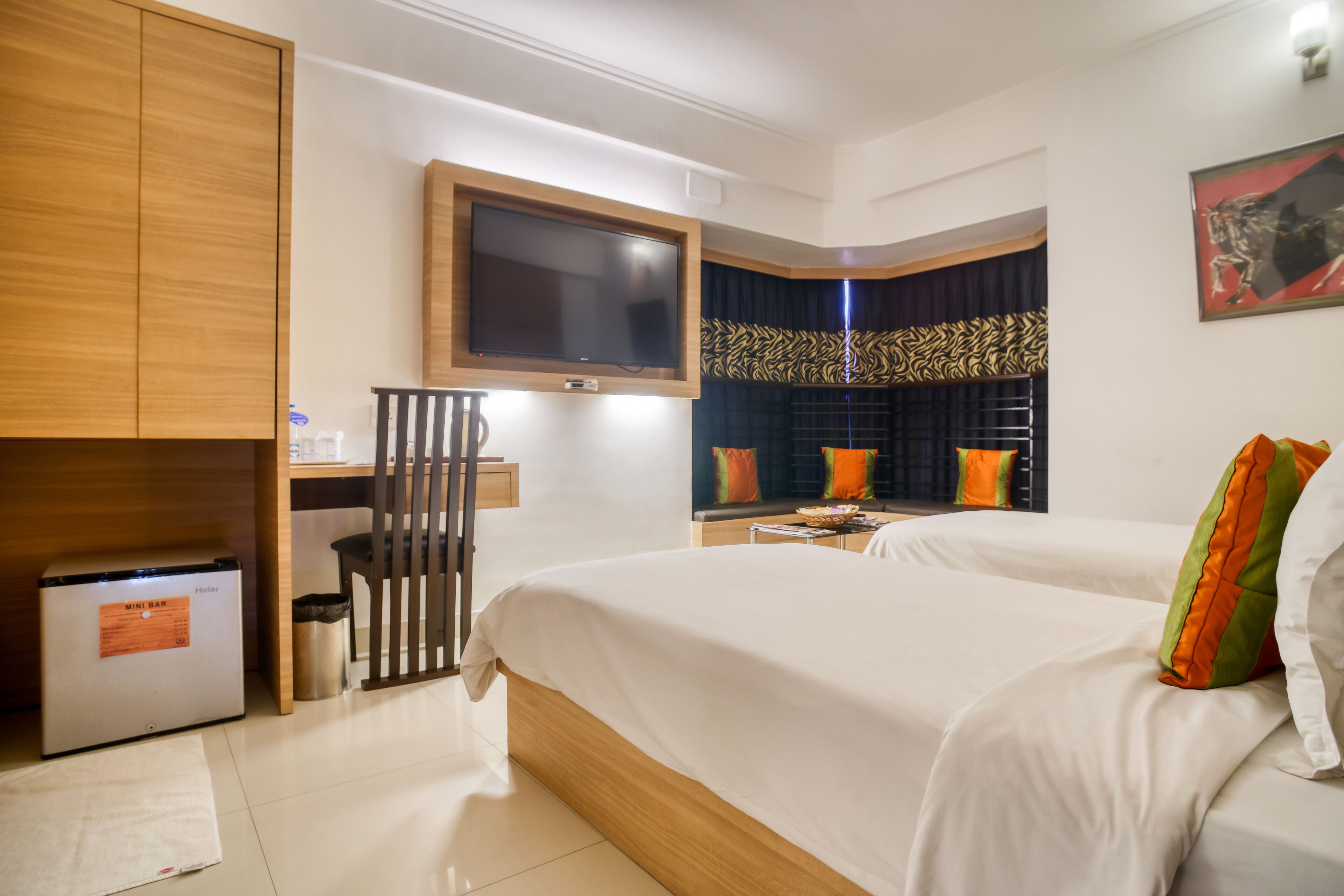 Premier Room with Bay Window Seating | Down comforters, minibar, desk, blackout drapes