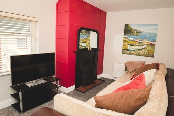 TV, fireplace, books