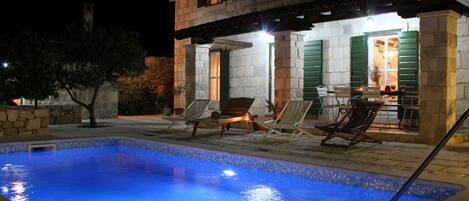 A heated pool, pool loungers