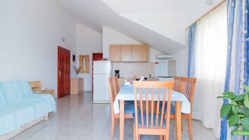 Apartment, 1 Bedroom, Terrace, Sea View | Living area | 20-inch flat-screen TV with cable channels, TV