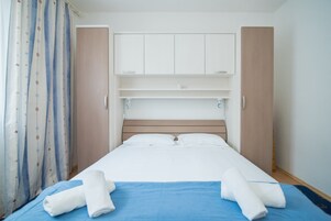 Apartment, 2 Bedrooms, Terrace, Sea View | 2 bedrooms, laptop workspace, iron/ironing board, free cots/infant beds