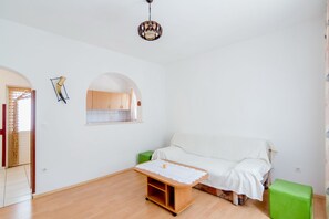 Apartment, 2 Bedrooms, Terrace, Sea View | Living room | 20-inch flat-screen TV with cable channels, TV - Apartments Ana & Bogdan (Postira)