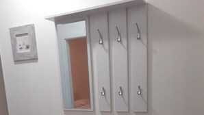 A white vanity with a mirror and a medicine cabinet above it.