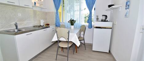 Fridge, stovetop, cookware/dishes/utensils