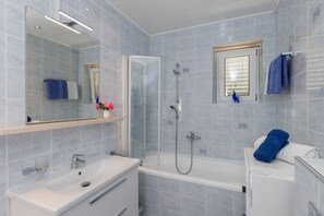 Bathtub, hair dryer, towels