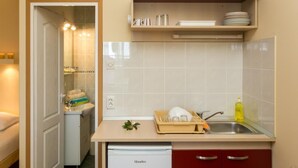 A compact kitchen with a dishwasher, a sink, and a small countertop. - Villa Iveta- Triple Room (Ground Floor) - Martina (Dubrovnik)