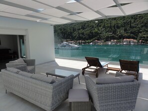 Relax on the spacious balcony with a clear view of the marina and surrounding landscape.