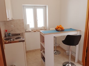 Fridge, stovetop, cookware/dishes/utensils