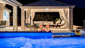 A pool area with a hot tub, lounge chairs, and a covered seating area with drinks. - Villa Blue Sky - Three Bedroom Villa with Pool (Bol)