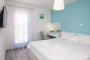 1 dormitorio, tabla de planchar con plancha, wifi gratis y ropa de cama