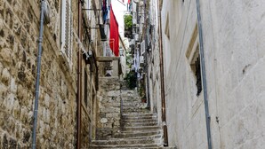 A narrow stone staircase leading up a building. - Apartments Minerva - One Bedroom Apartment No.1 (Dubrovnik)