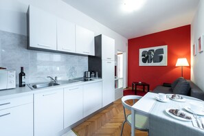 Fridge, microwave, stovetop, coffee/tea maker