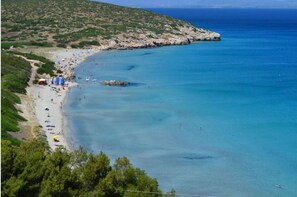 On the beach, sun loungers, beach towels