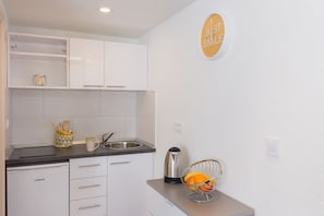 Fridge, stovetop, coffee/tea maker, toaster