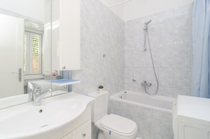 Bathtub, hair dryer, towels