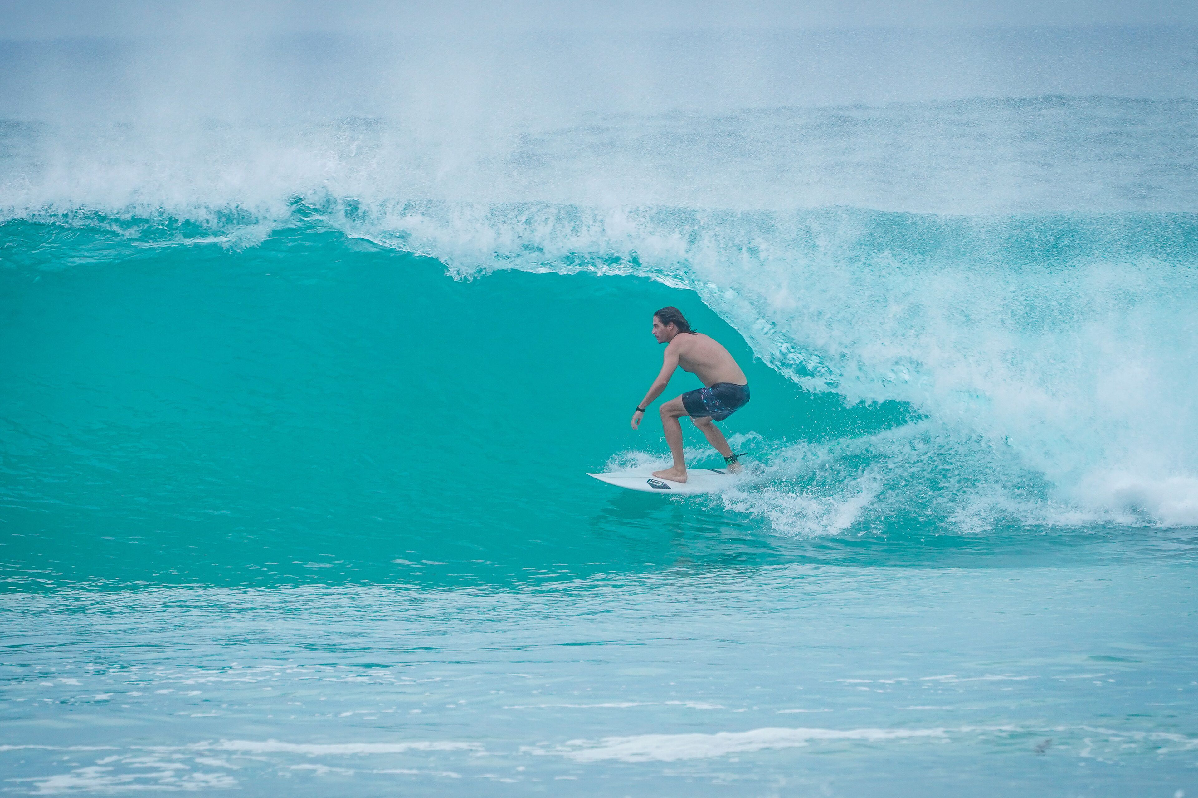 A person surfing a wave.