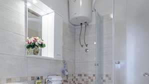 A bathroom with a toilet, sink, and shower. - Rooms Sani- Double Room with Terrace and Sea View (S2) (Brela)