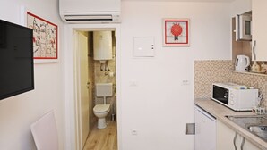 A compact kitchen with a microwave, a coffee maker, and a sink. - Nika Family Apartments - Basic Studio Apartment with External Terrace and Sea View (A5) (Dubrovnik)