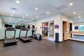 Stay active in our well-equipped fitness room featuring treadmills and an elliptical machine.