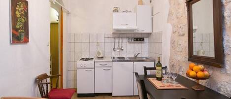 Fridge, microwave, stovetop, coffee/tea maker