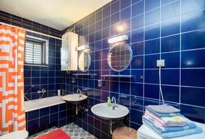 Bathtub, hair dryer, towels