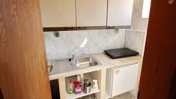 Fridge, cookware/dishes/utensils, dining tables