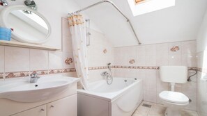 Bathtub, hair dryer, towels